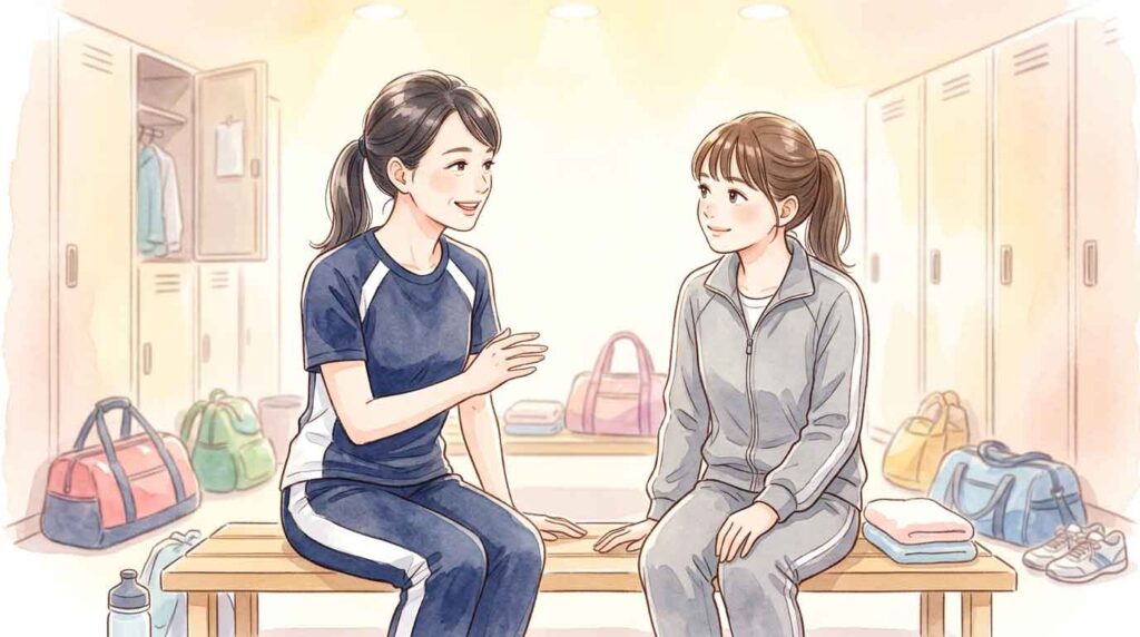 仲間に明るく声をかけ、チームの雰囲気を引き上げているスポーツウェアの女性