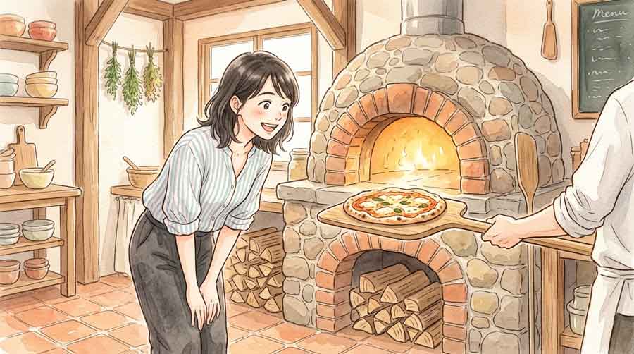 石窯から取り出した焼き立てピザを前に目を輝かせる女性